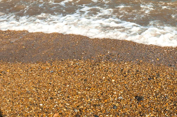 Ocean Wave Washes Over Sand and Pebble Beach, Incoming Tide, full frame, no people, concept or design,background, wallpaper, 