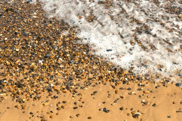 Ocean Wave Washes Over Sand and Pebble Beach, Incoming Tide, full frame, no people, concept or design,background, wallpaper, 