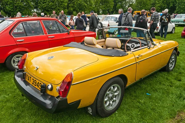 Hull, East Yorkshire, England, 11th June 2017, Classic British MG Sports Car, close up showing side and rear of yellow MGB roadster at East Park Classic Car Run.