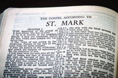 Close up of Holy Bible page, shallow depth of field with focus on book chapter heading, St Mark