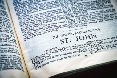 Close up of Holy Bible page, shallow depth of field with focus on book chapter heading, St John
