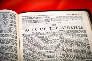 Close up of Holy Bible page, shallow depth of field with focus on book chapter heading, The Acts of the Apostles