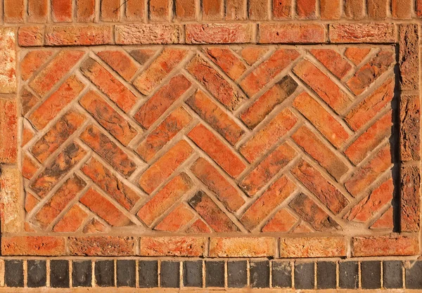 Brown, red herringbone brick wall, framed and insert