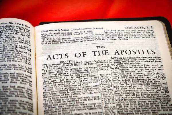 Close up of Holy Bible page, shallow depth of field with focus on book chapter heading, The Acts of the Apostles