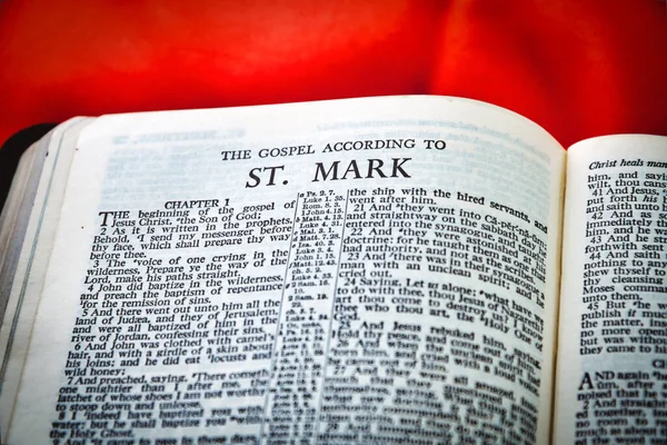 Close up of Holy Bible page, shallow depth of field with focus on book chapter heading, St Mark