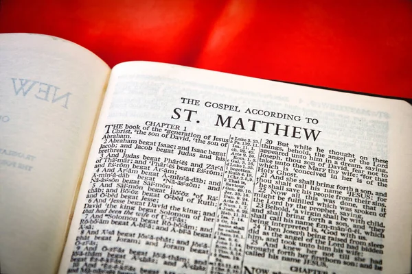 Close up of Holy Bible page, shallow depth of field with focus on book chapter heading, St Matthew