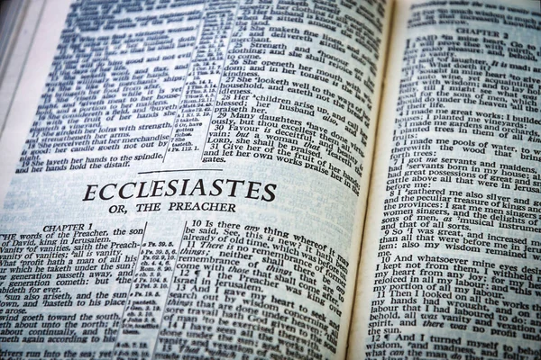 Close up of Holy Bible page, shallow depth of field with focus on book chapter heading, Ecclesiastes