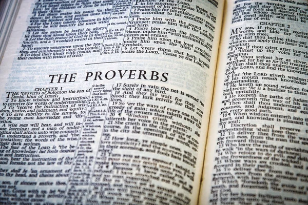 Close up of Holy Bible page, shallow depth of field with focus on book chapter heading, Proverbs