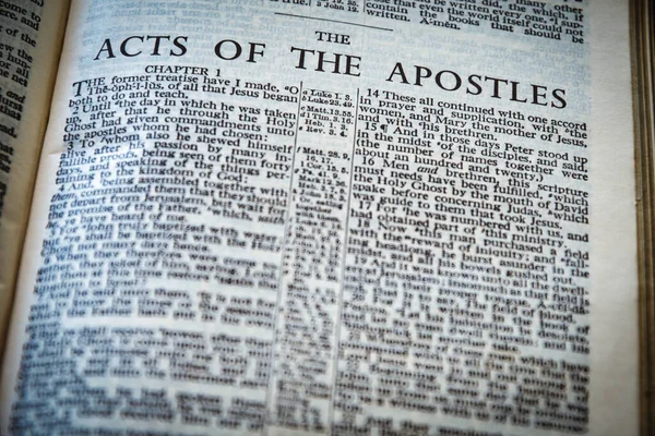 Close up of Holy Bible page, shallow depth of field with focus on book chapter heading, The Acts of the Apostles