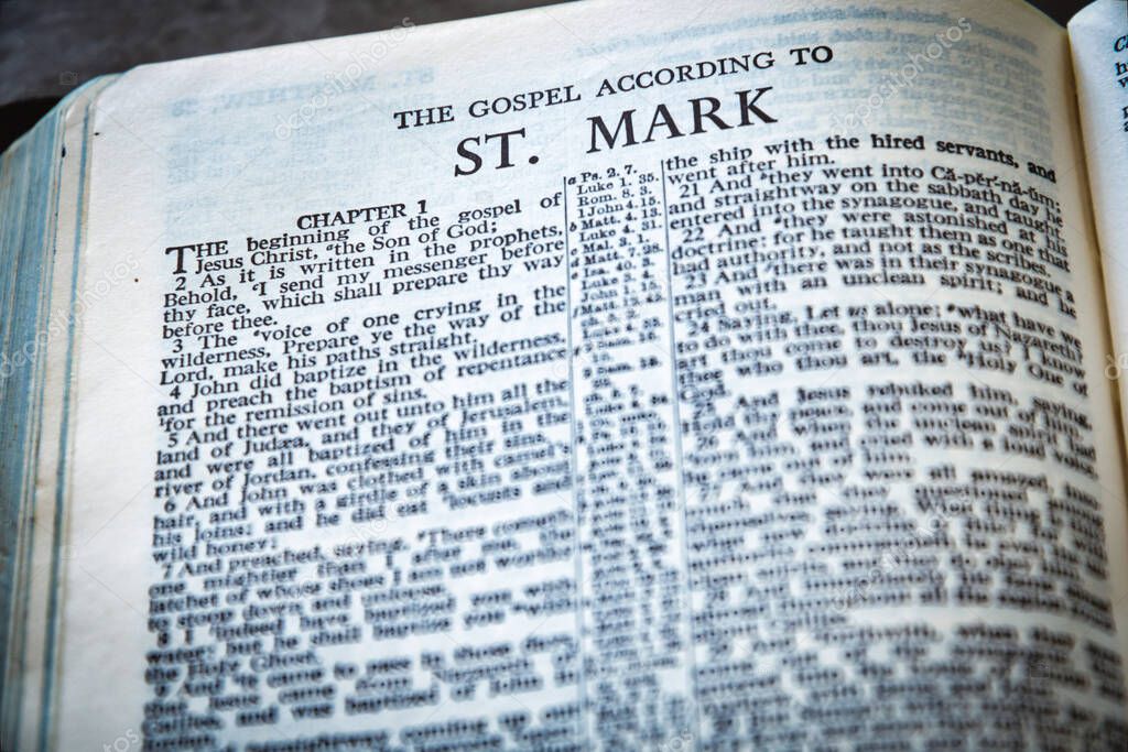 Close up of Holy Bible page, shallow depth of field with focus on book chapter heading, St Mark