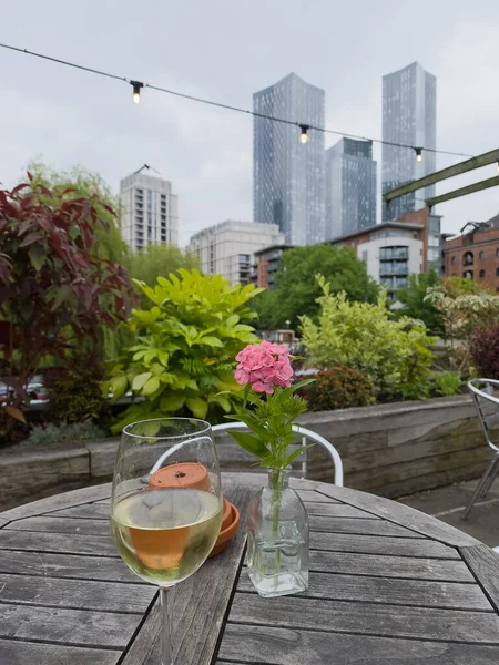 Glass White Wine Next Flower Table Outdoor Pub Skyscrapers Distance — Stock Fotó