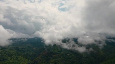 Aerial time lapse of fog over hills, after rain