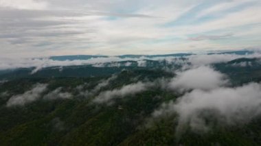 Aerial time lapse of fog over hills, after rain