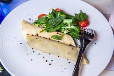 Dietary pancakes with cheese Avocado salad, tomato, spinach