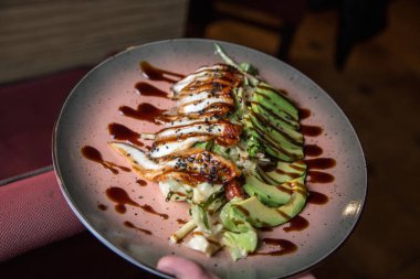 Salad with tuna and balsamic sauce. High quality photo