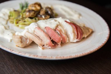 Appetizing dish in the restaurant. Creamy Bacon with Mushrooms. High quality photo