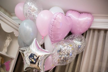 pink balloons in the room