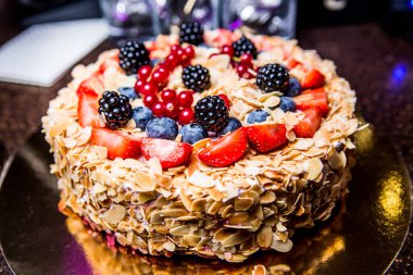 Fruit cake with nuts and berries