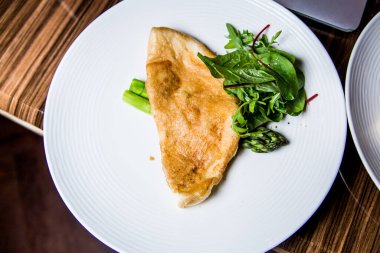 omelet with spinach on a plate