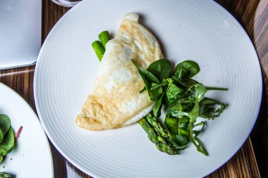 omelet with spinach on a plate