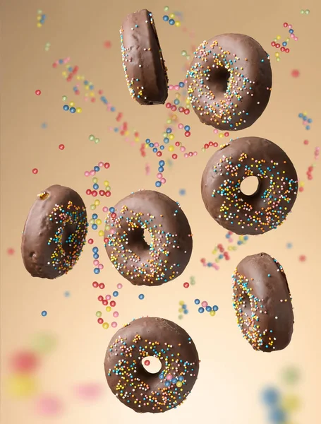 Chocolade Ronde Donuts Met Veelkleurige Suiker Hagelslag Zweven Een Beige — Stockfoto