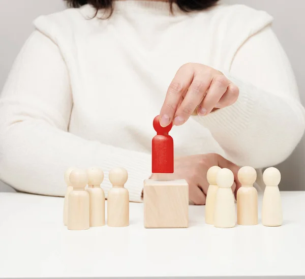 Woman Keeps Red Wooden Figurine Separate Group Career Growth Concept — Stockfoto