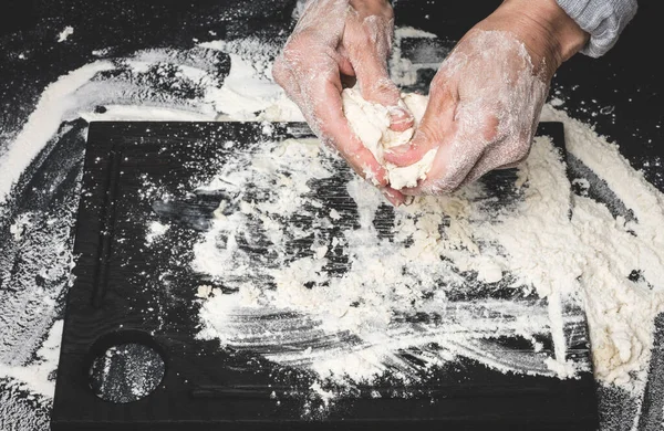 Two Female Hands Knead Dough White Wheat Flour Black Table — Stock Fotó