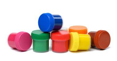 Plastic jars with multi-colored gouache on a white isolated background