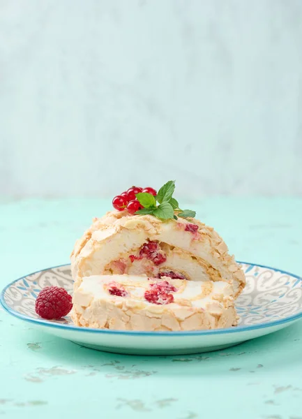 Baked Meringue Roll Red Berries Plate White Background — стоковое фото