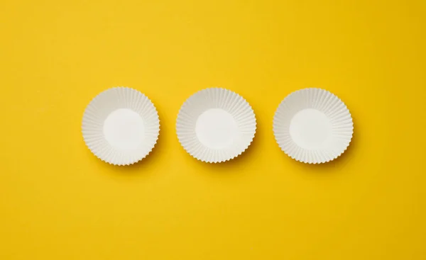 Empty White Paper Cupcake Molds Yellow Background Top View — Stock Photo, Image