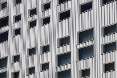 Windows on the facade of the building, in a modern minimalist architectural style