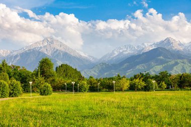 a favorite resting place of Almaty residents in the park of the first president against the backdrop of the Tien Shan mountains.