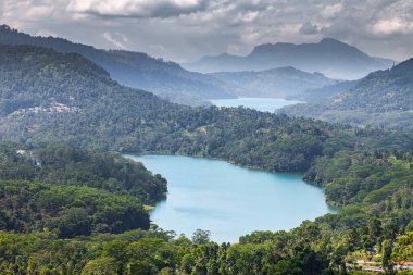 Magnificent two lakes among the jungle of the island of Sri Lanka under thunderclouds, vacation time