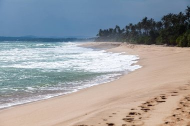 Restless waves on the shores of the Indian Ocean. Tangalle. Sri Lanka