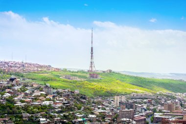 Aerial view of TV tower and sunshine in background