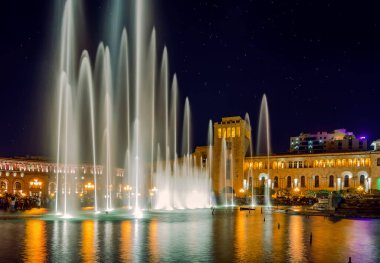 Singing and Dancing Fountains in Republic Square in Yerevan. Night city lights show.