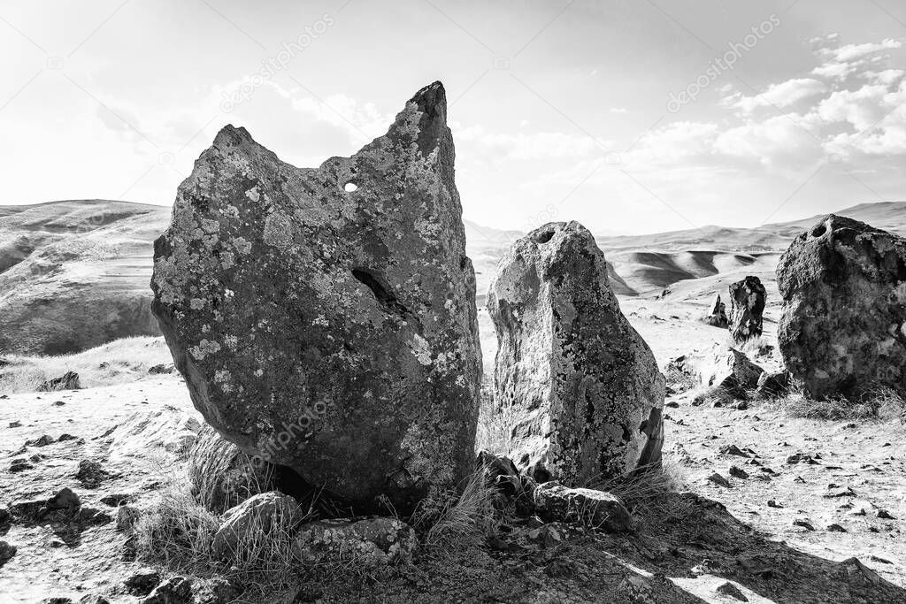 Megalithic standing stone of Zorats Karer or Carahunge - prehistoric monument in Armenia. Toned