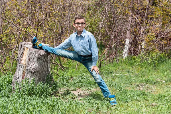 Boy is trying to make twine