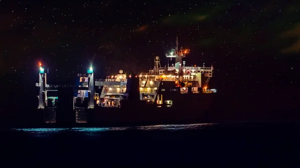 Cargo Ship in the Ocean in the night