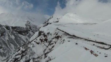 Aerial view of beautiful snowy mountains in Gudauri, Georgia