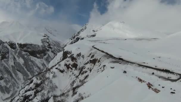 Aerial view of beautiful snowy mountains in Gudauri, Georgia — Stockvideo