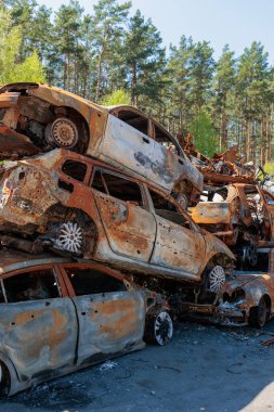 Many shot and destroyed cars at the car graveyard in Irpin, Ukraine. irpin car cemetery