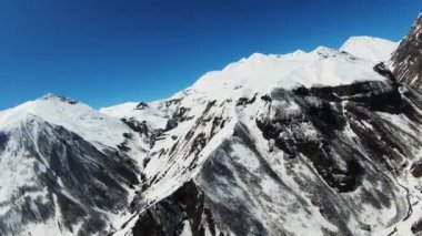 Aerial view of beautiful snowy mountains in Gudauri, Georgia. shooting from a quadcopter