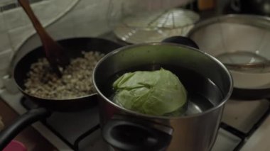 whole cabbage for stuffed cabbage boiled in a saucepan. home made food
