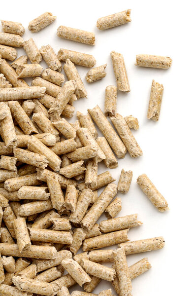Wood pellets fuel close-up, on white background