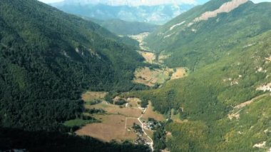 Montenegro. Prokletiye National Park. Summer. Mountain green valley. Popular tourist spot. Drone. Aerial view. The camera moves forward