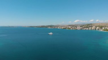 Croatia. Bay with yachts on the Adriatic coast. Summer. Tourist season. Popular place to relaxation. Drone. Aerial view. The camera moves from left to right