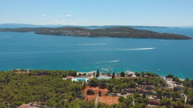Croatia. Bay on the coast of the Adriatic Sea. Summer. Tourist season. Popular place to relaxation. Drone. Aerial view. The camera moves from left to right