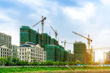 Construction sites and cranes at dusk