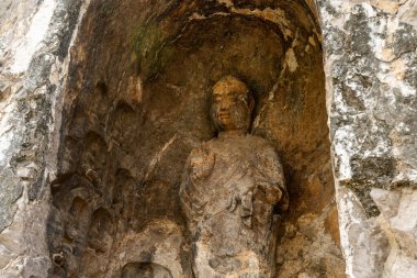 Carved Buddha Limestone at Longmen Grottoes or Caves (Dragon gate Grottoes), The World Heritage Site in Luoyang, Henan province, China.